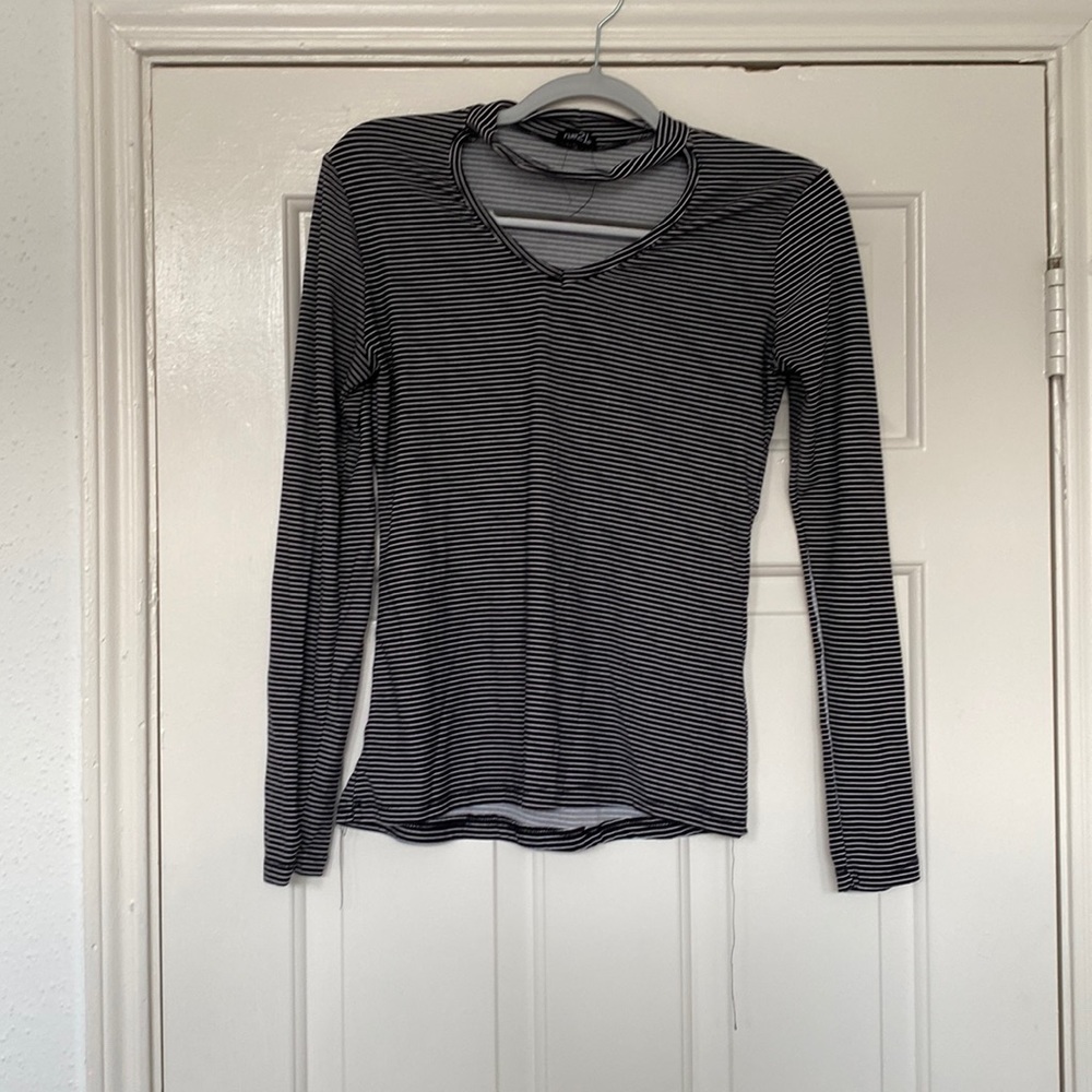 Long sleeve black and white striped top with keyhole cutout